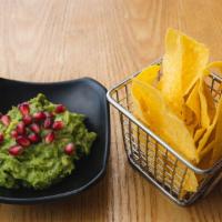 Guacamole Con Granada · Chunky guacamole topped with fresh pomegranate served with homemade tortilla chips.