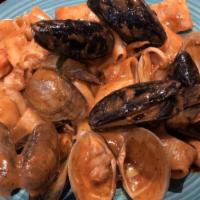 Linguine Al Frutti Di Mare · Clams - mussels - calamari - shrimp -  squid ink sauce