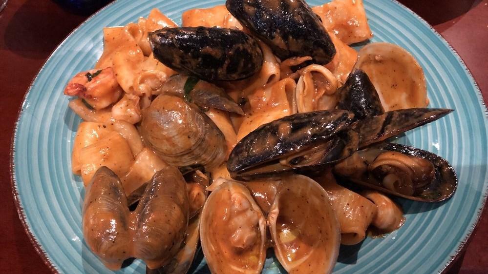 Linguine Al Frutti Di Mare · Clams - mussels - calamari - shrimp -  squid ink sauce