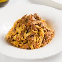 Spaghetti Alla Carbonara · Spaghetti with “guanciale” tossed in eggs and Pecorino cheese.
