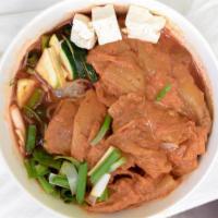 S3 Kimchi Ji Gae · Spicy kimchi stew with pork, sweet potato noodles, tofu and other vegetables. Served with wh...
