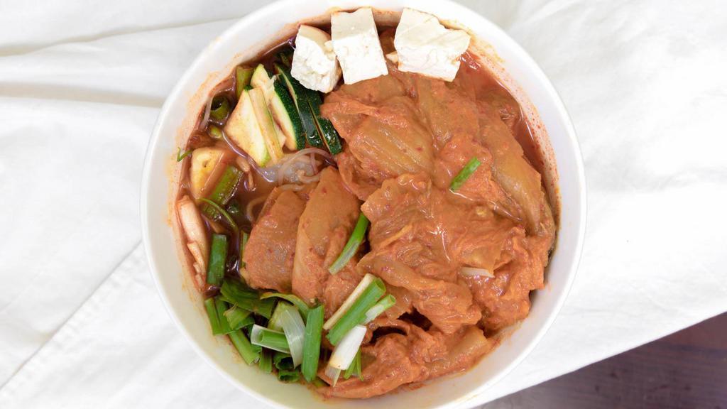 S3 Kimchi Ji Gae · Spicy kimchi stew with pork, sweet potato noodles, tofu and other vegetables. Served with white rice.