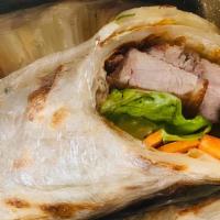 Duck Wrap · Crispy roasted duck, carrot, cucumber and celery wrapped in roti bread and served with sweet...