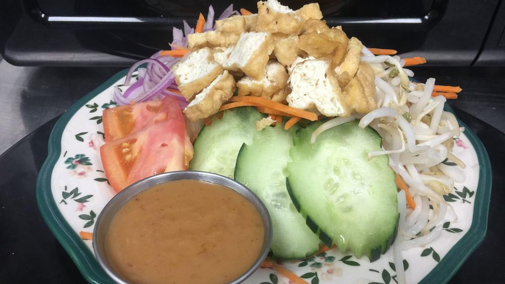 Thai Style Salad · Lettuce, tomato, shallot, bean sprout and fried tofu with side of peanut dressing. * 
 
*100 % Vegan Friendly