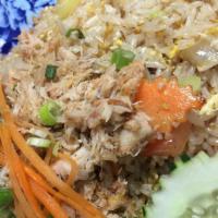 Crab Meat Fried Rice · Fried rice with onion scallion egg and crab meat on top.