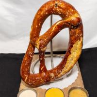 Giant Bavarian Pretzel · Served with beer cheese, honey mustard, and Rum Chata cream sauce.