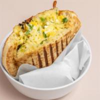Fancy Egg & Cheese Pita · Scrambled egg, cilantro, feta cheese and Jack cheese in pita sandwich.