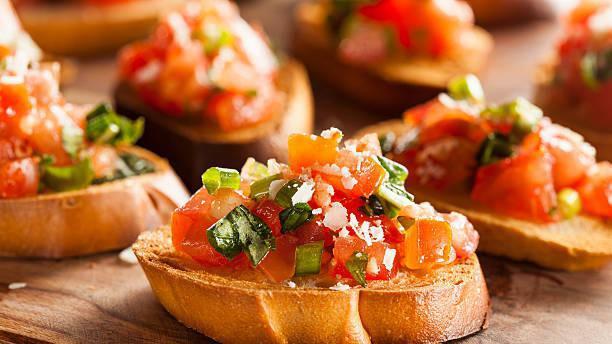Bruschetta · Toasted bread, tomato, red onion, balsamic, and olive oil.