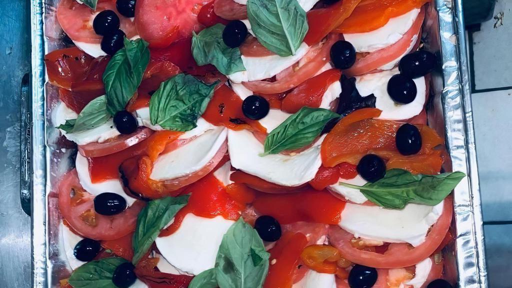 Caprese Salad · Beefsteak tomatoes, fresh mozzarella, basil, extra virgin, and balsamic.