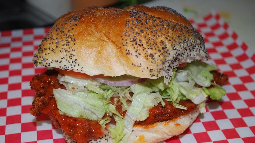 Bleu Cheese Chicken Sandwich Lunch · Includes -- a Sandwich with Fried Chicken, Bleu Cheese Dressing, Hot Buffalo Sauce, lettuce, tomatoes, & onions on a seeded roll, -- a Small Seasoned Fries,  -- and a Small Drink of your choice.