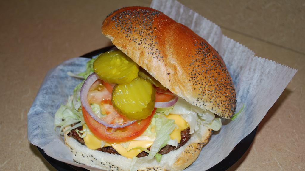 Cheeseburger · 8 oz. Burger with American Cheese, Lettuce, Tomato, Onions, and Pickles on a Seeded Roll.