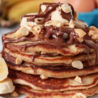 Nutella Banana Pancakes (5 Stacks) · Five  stack of pancakes with Nutella and bananas.