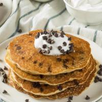 Chocolate Chip  Pancakes (5 Stack) · Five stack of pancakes with chocolate chips and chocolate sauce.
