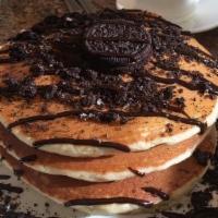 Oreo Pancakes (5 Stack) · Five  stack of pancakes with marshmallow, crushed OREO's and chocolate sauce.