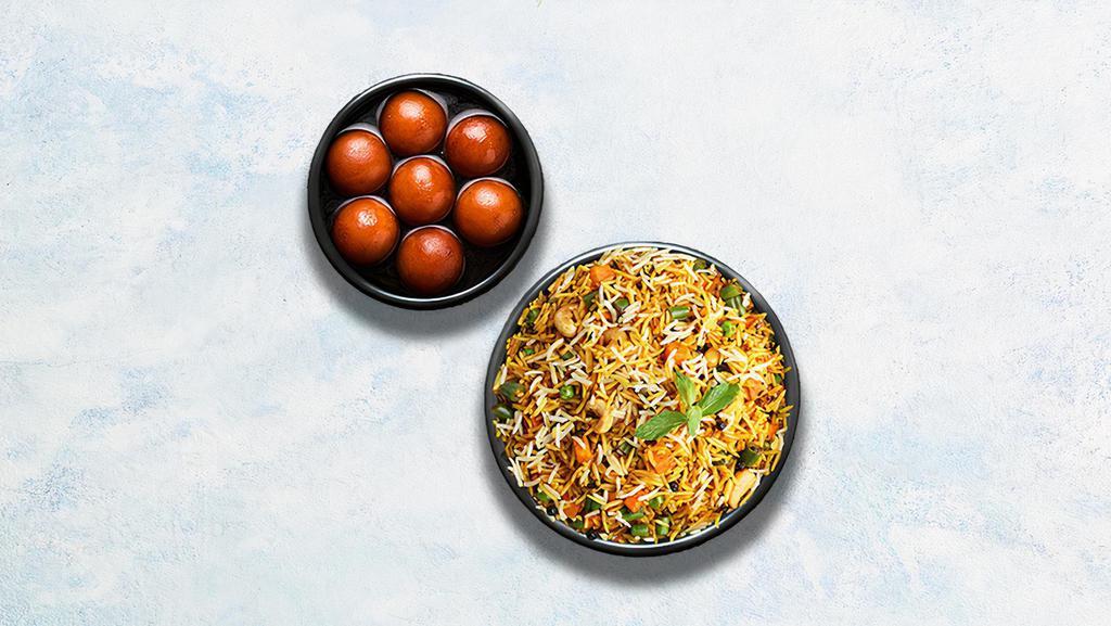 Vegetable Biryani & Gulab Jamun · Long grain basmati rice cooked with farm-fresh vegetables and aromatic Indian herbs. Served with soft berry-sized balls soaked in rose flavored sugar syrup.