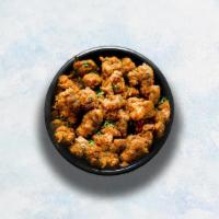 Chicken Pakora · Chicken batter-fried to perfection and seasoned with herbs. Served with our signature mint r...