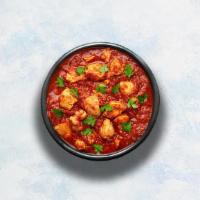 Chicken Vindaloo · Tender chicken marinated in vinegar and garlic cooked to perfection with hot Indian aromatic...