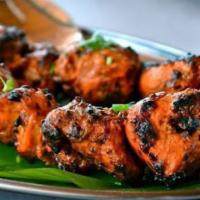 Mahi Tandoori · Fillets of salmon spiced and grilled in the clay oven.