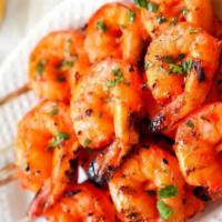 Tandoori Shrimp · Jumbo shrimps marinated in a traditional style with a dash of saffron; cooked in tandoor.