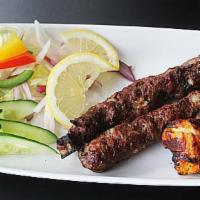 Lamb Seekh Kabab · Skewered ground lamb grilled, tempered with chopped onion, ginger, garlic, saffron and spices.