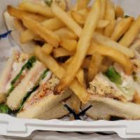 Club Sandwich · Roast turkey or ham, Swiss cheese, lettuce, tomatoes & mayo, (French fries).