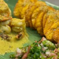 Camarones En Salsa (Shrimp On Sauce) · Sauteed Shrimp on our house mad white sauce. your choice of tostones, french fries or sweet ...