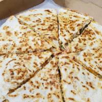 Quesadilla · Cooked tortilla that is filled with cheese and folded in half.