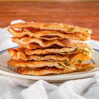 Scallion Pancakes · Savory folded flatbread.