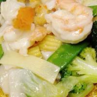 Seafood Pan Fried Noodle · Pan Fried Crispy Noodle topped with Jumbo Shrimp, Calamari, Scallop, Crabmeat and Vegetables