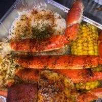 Seafood Boil · 2 clusters of delicious juicy Crab Legs in a tray with white rice, Sweet Corn , 2 potatoes ,...
