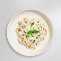 Alfredo Pasta · Fettuccine pasta cooked in creamy white sauce and aged parmesan. Served with bread.