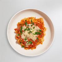 Creamy Tomato Pasta · Creamy tomato and white sauce blend cooked with fettuccine. Served with bread.