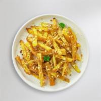 Garlic Parmesan Fries · Idaho potato fries cooked until golden brown & garnished with salt, garlic, and parmesan.