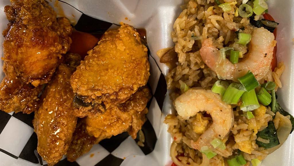 Garlic Fried Rice And Chicken Wings Special · 4 plain pressure-fried wings with a side of garlic fried rice. Make it tossed or add seasoned chicken or shrimp to your rice for an additional charge.