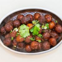 Manchurian · Vegetarian. Veg deep fried balls tossed with soya sauce based gravy cooked to chefs perfecti...
