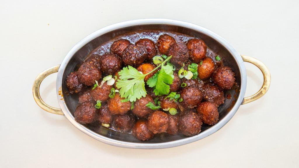 Manchurian · Vegetarian. Veg deep fried balls tossed with soya sauce based gravy cooked to chefs perfection.