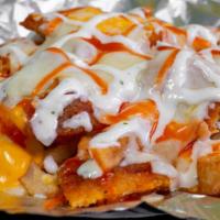 Buffalo Fries · Fried Chopped Buffalo Chicken Served With Melted Mozzarella & Nacho Cheese. Topped With Ranc...