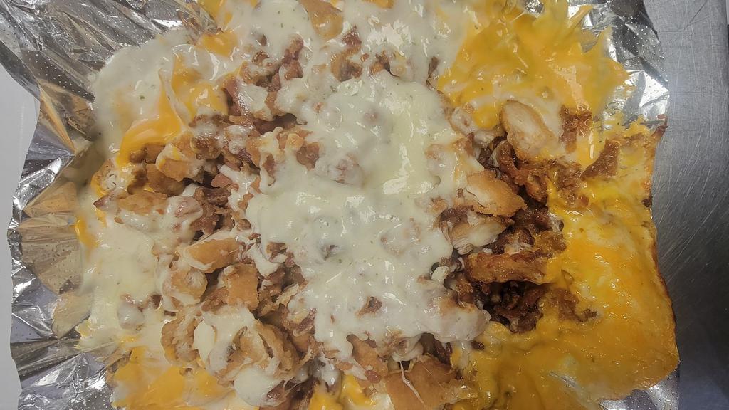 Chicken Bacon Ranch Fries · Chopped Fried Chicken And Bacon. Topped With Mozzarella, Nacho Cheese & Ranch Dressing.