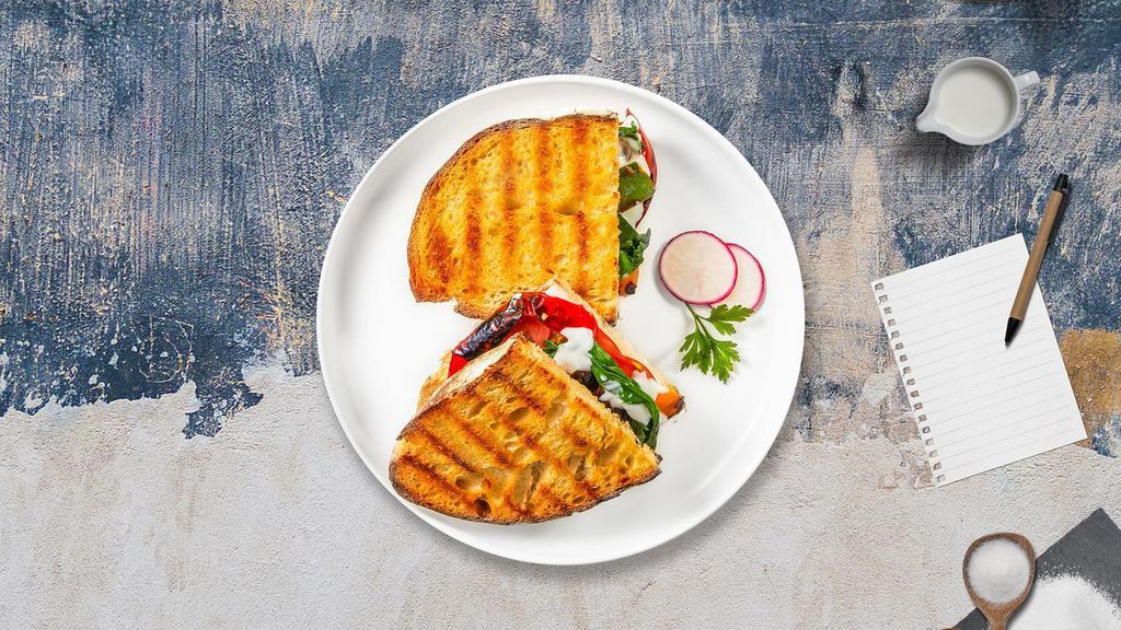 The Bertolucci Panini · Fresh mozzarella, tomato, and basil on freshly baked bread. Served with a salad.