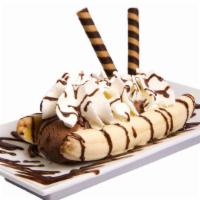 Vanilla Ice Cream Banana Split · A whole banana with 3 scoops of delicious Haagen-Dazs vanilla ice cream, chocolate syrup, st...