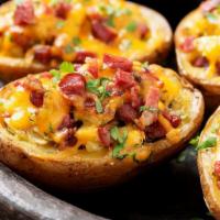 Potato Skins · Hearty potato wedges stuffed with crumbled bacon and creamy cheddar cheese.