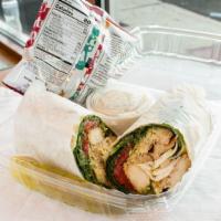Manny'S Wrap · Grilled chicken, fresh mozzarella, roasted peppers, arugula, and pesto sauce. Served with ch...