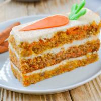 Carrot Cake · Moist cake, filled with spiced walnuts and golden raisins and frosted with cream cheese.