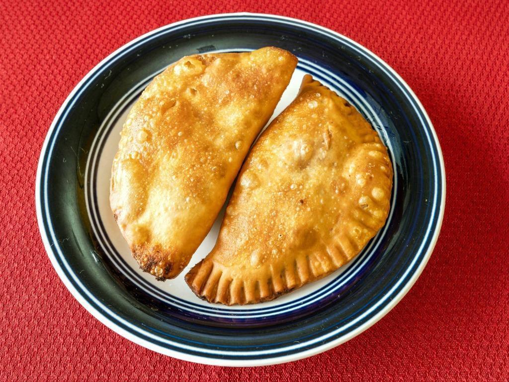 Empanadas 2Pcs · Fried pastry shell filled with beef or chicken.