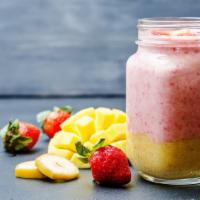 Mango Madness Smoothie · Fresh blended smoothie with Mango, strawberry, pineapple, orange juice.