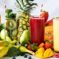 Tropical Smoothie · Fresh blended smoothie with Mango, banana, pineapple, blueberry, and coconut water.