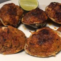 Almejas Rellenas De Mariscos · Baked seafood stuffed clams.