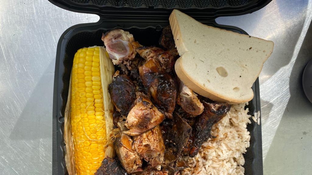 Jerk Chicken Platter · Jerk Chicken with rice, roasted corn, and hardough bread.
