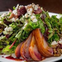 Poached Pear Salad · Baby mixed greens, caramelized walnuts and poached Williams pears finished with barolo wine ...