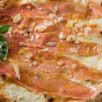 Speck & Brie Pizza · Smoked prosciutto, brie, parmeseano, extra virgin olive oil and basil.